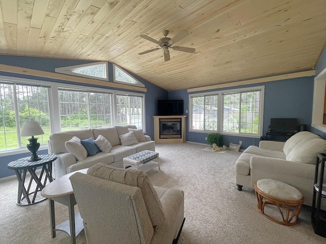 16173 Discovery Cir, Park Rapids, MN 56470 - living area with carpet flooring, wood ceiling, vaulted ceiling, ceiling fan, and a glass covered fireplace