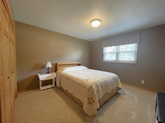 16173 Discovery Cir, Park Rapids, MN 56470 - bedroom featuring light colored carpet, a textured ceiling, and baseboards