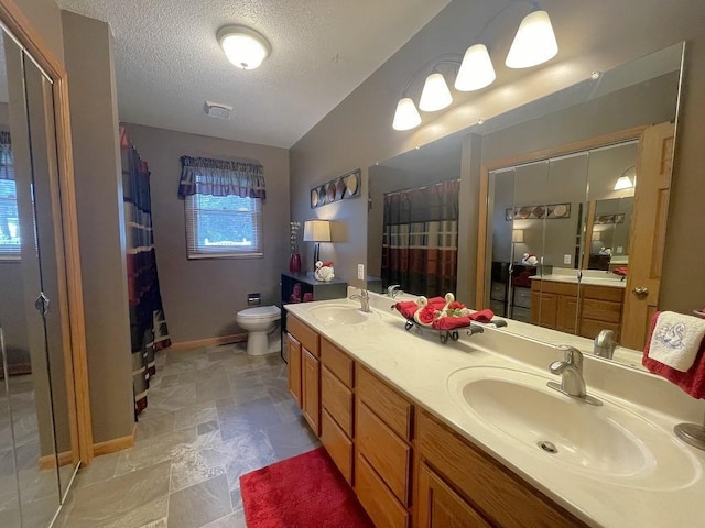 16173 Discovery Cir, Park Rapids, MN 56470 - full bathroom with baseboards, a textured ceiling, double vanity, a shower with shower curtain, and toilet