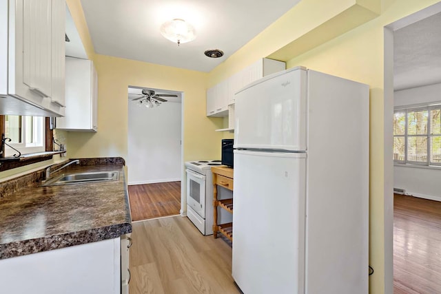 3671 Robinwood Ter, Minnetonka, MN 55305 - kitchen featuring white appliances, a sink, dark countertops, white cabinetry, and ceiling fan