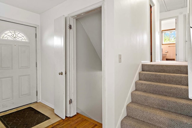 3671 Robinwood Ter, Minnetonka, MN 55305 - foyer featuring light wood finished floors, stairs, and baseboards