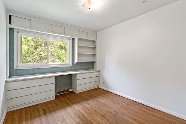 3671 Robinwood Ter, Minnetonka, MN 55305 - unfurnished office with built in study area, baseboards, and wood finished floors