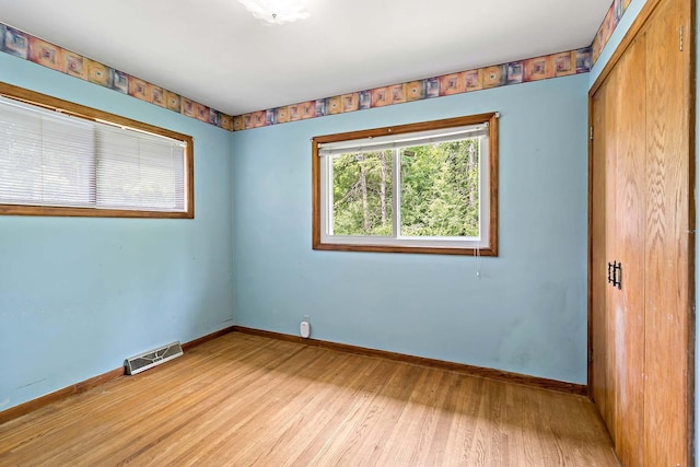 3671 Robinwood Ter, Minnetonka, MN 55305 - spare room with light wood-style floors and baseboards