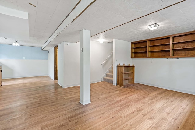 3671 Robinwood Ter, Minnetonka, MN 55305 - finished basement with light wood finished floors, stairway, and baseboards