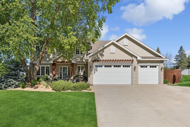 14057 Flintwood Ct, Apple Valley, MN 55124 - view of front facade with brick siding, an attached garage, and concrete driveway