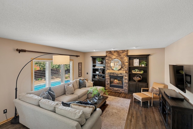14057 Flintwood Ct, Apple Valley, MN 55124 - living area with a textured ceiling, dark wood finished floors, and a fireplace