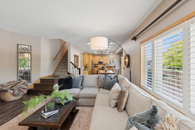 14057 Flintwood Ct, Apple Valley, MN 55124 - living room featuring stairs, recessed lighting, and wood finished floors