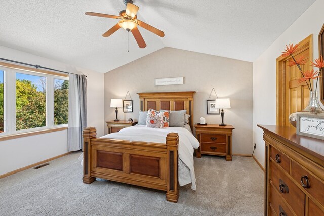 14057 Flintwood Ct, Apple Valley, MN 55124 - bedroom featuring lofted ceiling, light carpet, a textured ceiling, and ceiling fan