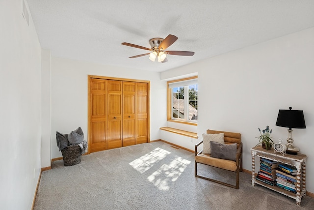 14057 Flintwood Ct, Apple Valley, MN 55124 - sitting room with ceiling fan and carpet floors
