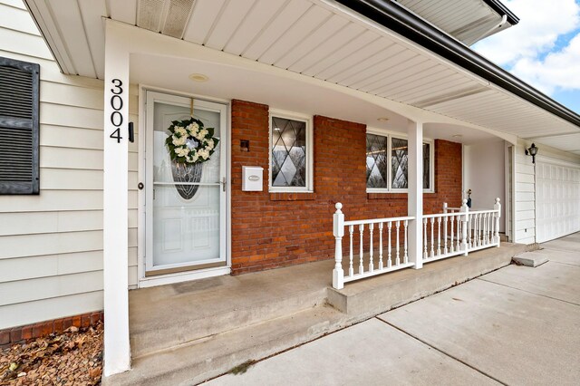 3004 36th Ave NE, Saint Anthony, MN 55418 - doorway to property with a porch and brick siding