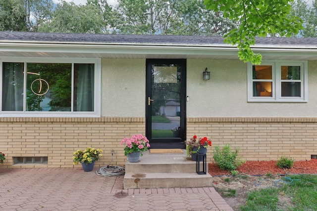 9320 Revere Ln N, Maple Grove, MN 55369 - property entrance with brick siding and stucco siding