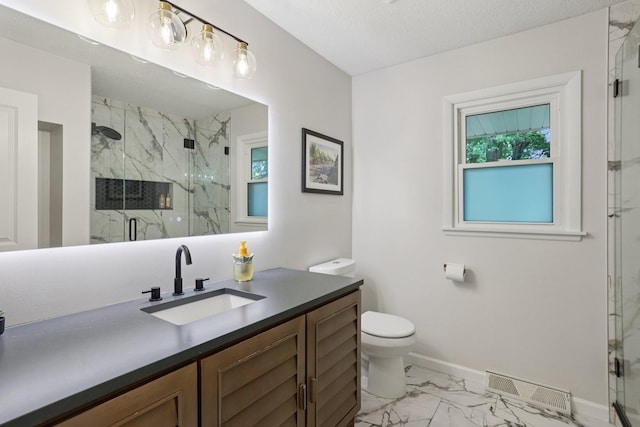 9320 Revere Ln N, Maple Grove, MN 55369 - bathroom with marble finish floors, vanity, toilet, baseboards, and a marble finish shower