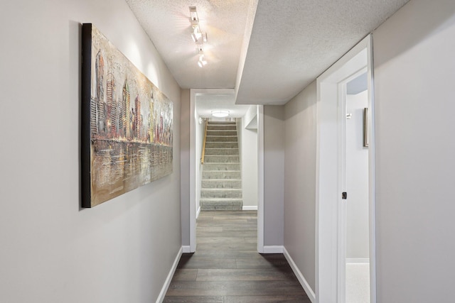 9320 Revere Ln N, Maple Grove, MN 55369 - corridor with dark wood-style floors, a textured ceiling, stairs, and baseboards