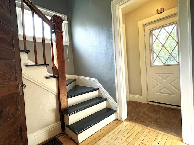 638 James St, Ely, MN 55731 - entrance foyer with stairway, baseboards, and tile patterned flooring
