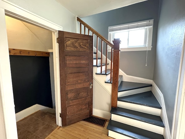 638 James St, Ely, MN 55731 - stairs featuring baseboards and wood finished floors
