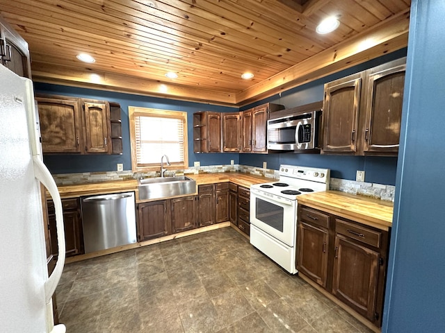 638 James St, Ely, MN 55731 - kitchen featuring appliances with stainless steel finishes, butcher block countertops, open shelves, wooden ceiling, and a sink
