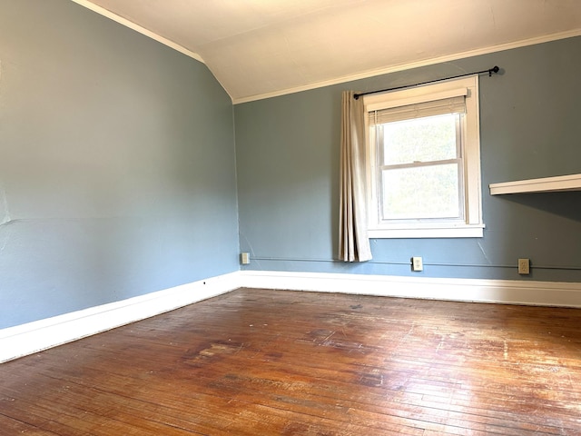 638 James St, Ely, MN 55731 - spare room with crown molding, baseboards, hardwood / wood-style flooring, and vaulted ceiling