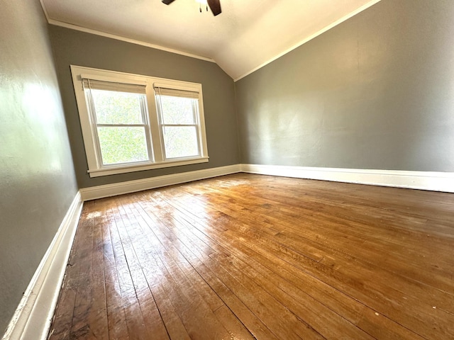 638 James St, Ely, MN 55731 - empty room with hardwood / wood-style flooring, a ceiling fan, vaulted ceiling, baseboards, and ornamental molding