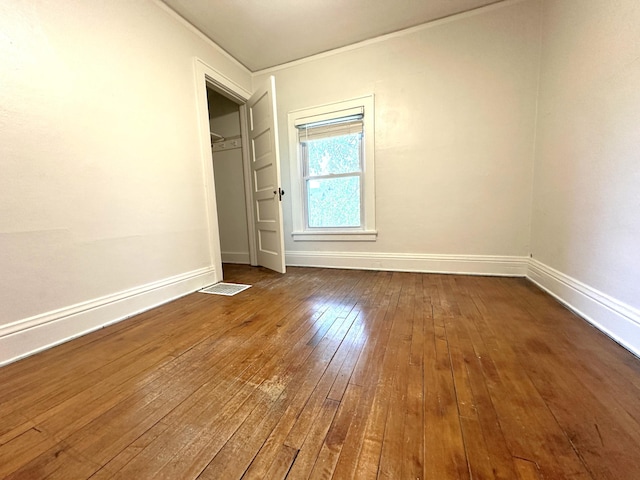 638 James St, Ely, MN 55731 - unfurnished bedroom with dark wood finished floors and baseboards