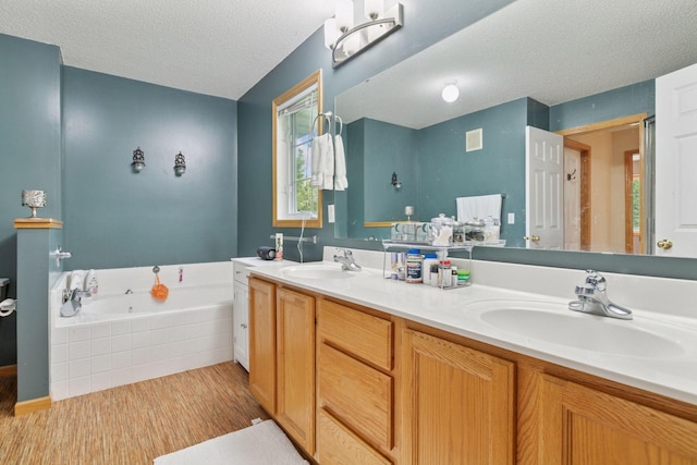 9026 Merrimac Ln N, Maple Grove, MN 55311 - bathroom featuring a textured ceiling, double vanity, a garden tub, and wood finished floors