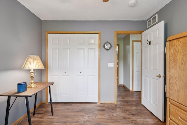 9026 Merrimac Ln N, Maple Grove, MN 55311 - bedroom featuring a closet, wood finished floors, and baseboards