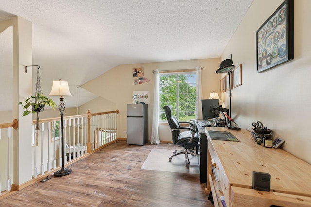 9026 Merrimac Ln N, Maple Grove, MN 55311 - office area featuring wood finished floors, a textured ceiling, and vaulted ceiling