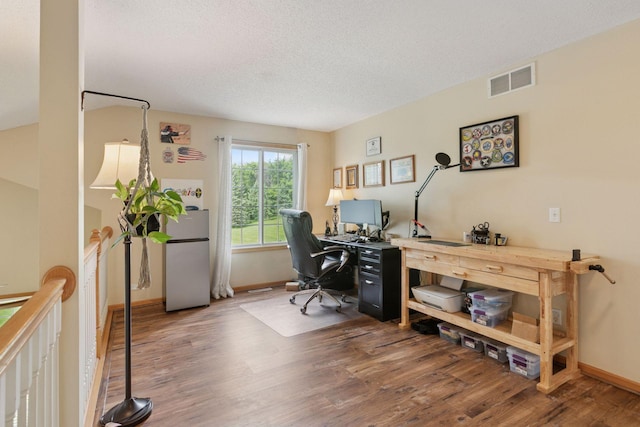 9026 Merrimac Ln N, Maple Grove, MN 55311 - office featuring wood finished floors, baseboards, and a textured ceiling