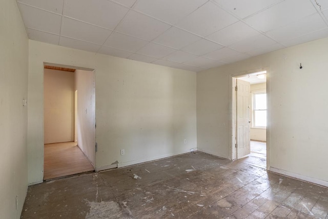 717 2nd Ave NE, Waseca, MN 56093 - unfurnished room with a drop ceiling and baseboards