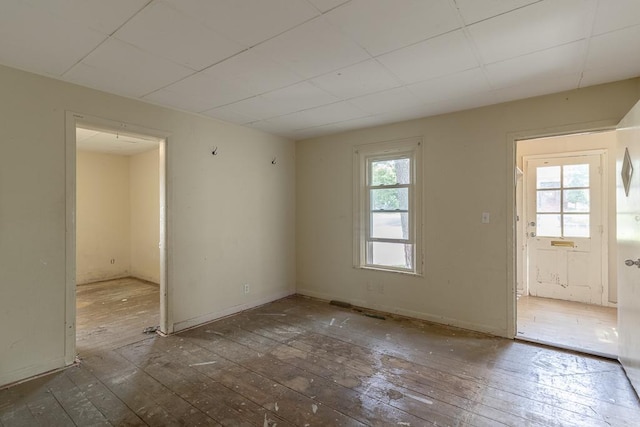 717 2nd Ave NE, Waseca, MN 56093 - empty room with wood-type flooring and baseboards
