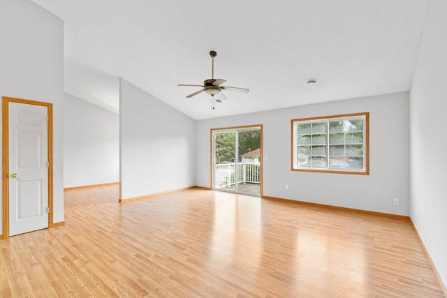 5423 Elm Grove Ave, New Hope, MN 55428 - unfurnished room with light wood-style floors, a ceiling fan, and lofted ceiling