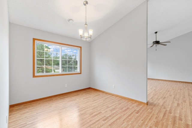5423 Elm Grove Ave, New Hope, MN 55428 - spare room with light wood finished floors, vaulted ceiling, a chandelier, and ceiling fan