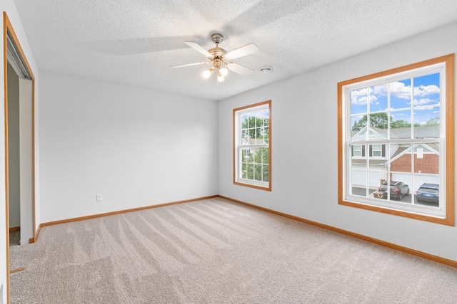 5423 Elm Grove Ave, New Hope, MN 55428 - unfurnished bedroom featuring carpet flooring, a closet, a textured ceiling, and a ceiling fan