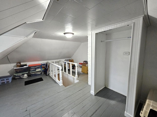 702 Junius Ave, Fergus Falls, MN 56537 - additional living space featuring hardwood / wood-style floors and vaulted ceiling