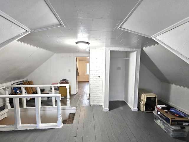 702 Junius Ave, Fergus Falls, MN 56537 - additional living space with hardwood / wood-style floors and vaulted ceiling