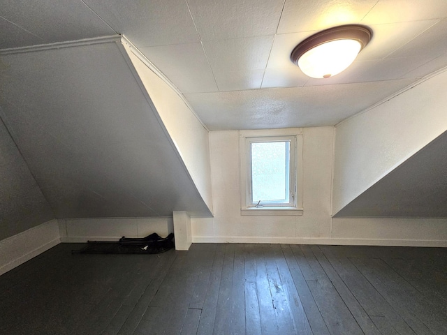 702 Junius Ave, Fergus Falls, MN 56537 - additional living space with dark wood-style flooring and baseboards