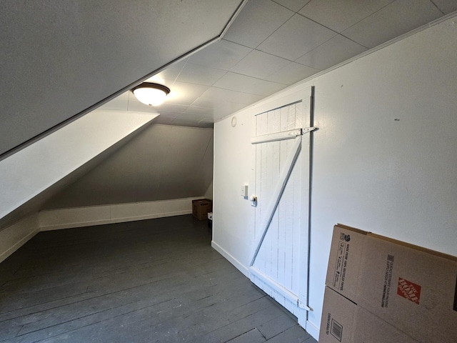702 Junius Ave, Fergus Falls, MN 56537 - additional living space featuring hardwood / wood-style flooring and lofted ceiling