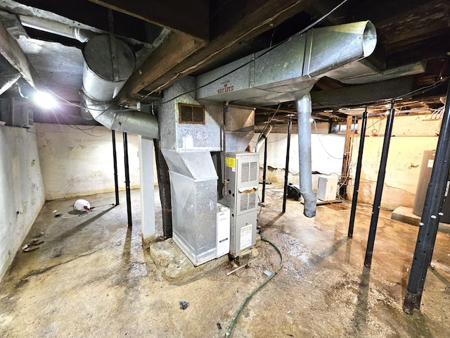 702 Junius Ave, Fergus Falls, MN 56537 - unfinished below grade area with heating unit