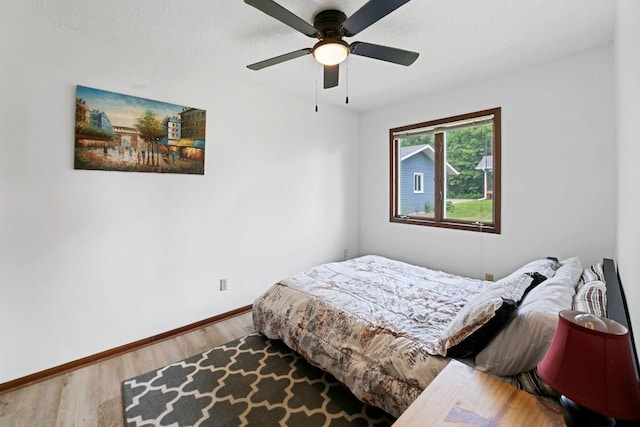 6567 Shore Trl N, Forest Lake, MN 55025 - bedroom with wood finished floors and ceiling fan