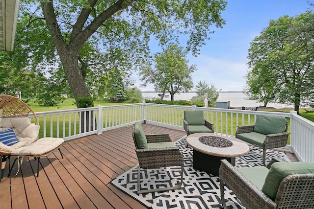 6567 Shore Trl N, Forest Lake, MN 55025 - wooden deck featuring a water view, a fire pit, and a lawn