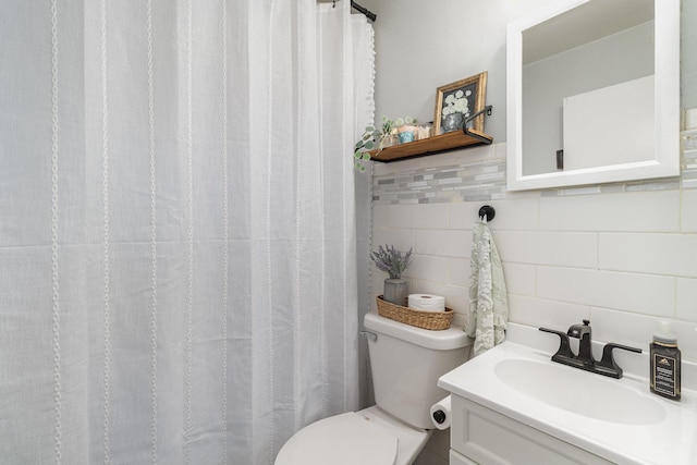 2211 108th Ave NW, Coon Rapids, MN 55433 - full bathroom with decorative backsplash, toilet, vanity, and tile walls