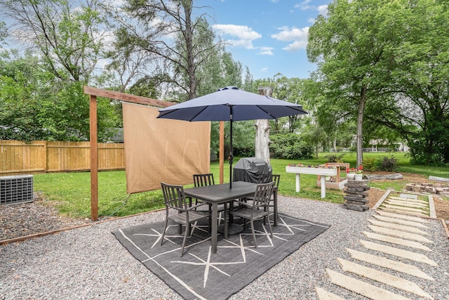 2211 108th Ave NW, Coon Rapids, MN 55433 - view of patio / terrace featuring outdoor dining area and area for grilling