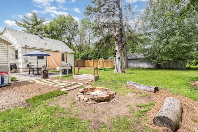 2211 108th Ave NW, Coon Rapids, MN 55433 - view of yard featuring an outdoor fire pit and a patio