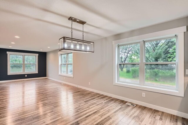 2865 Pilot Knob Rd, Eagan, MN 55121 - spare room featuring baseboards and light wood-style flooring