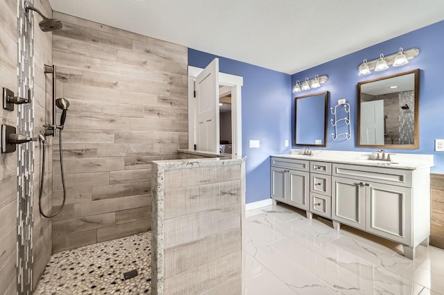 2865 Pilot Knob Rd, Eagan, MN 55121 - full bath with walk in shower, double vanity, marble look tile flooring, and baseboards
