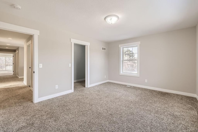 2865 Pilot Knob Rd, Eagan, MN 55121 - unfurnished bedroom with carpet floors, multiple windows, and baseboards