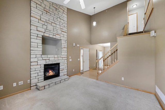 17790 66th Ave N, Maple Grove, MN 55311 - unfurnished living room featuring carpet floors, ceiling fan, stairs, and a towering ceiling