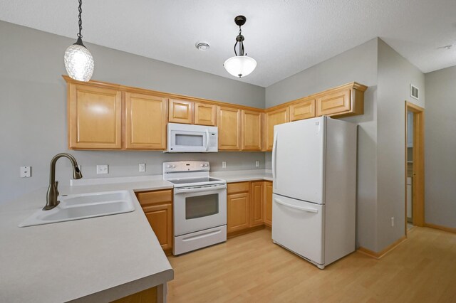 17790 66th Ave N, Maple Grove, MN 55311 - kitchen featuring white appliances, light wood finished floors, pendant lighting, light countertops, and light brown cabinetry
