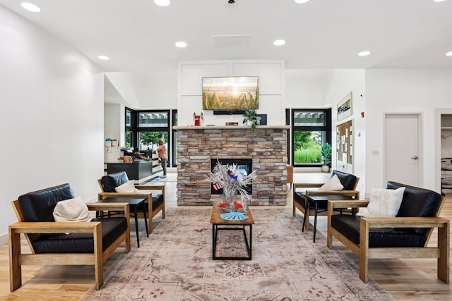 15040 Farnham Ave N, Hugo, MN 55038 - living area featuring wood finished floors, recessed lighting, and a fireplace