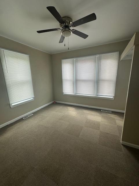 2014 Oakland Ave, Austin, MN 55912 - carpeted empty room featuring baseboards and ceiling fan