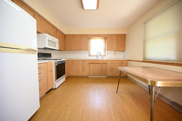 952 Fuller St S, Shakopee, MN 55379 - kitchen with white appliances, a sink, light countertops, and light brown cabinets
